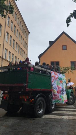 Graduates driving away on their truck