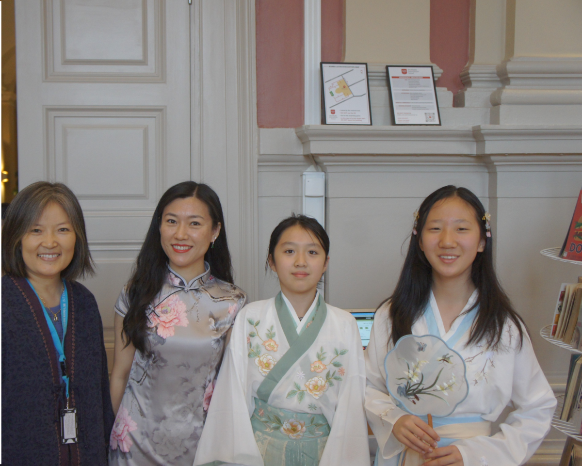 Students and parents in traditional clothing