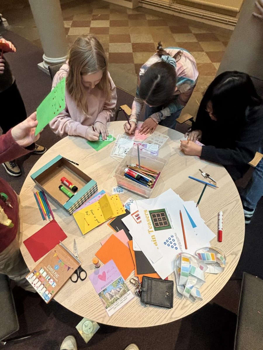 Kids working to make cards for the Nepal Project